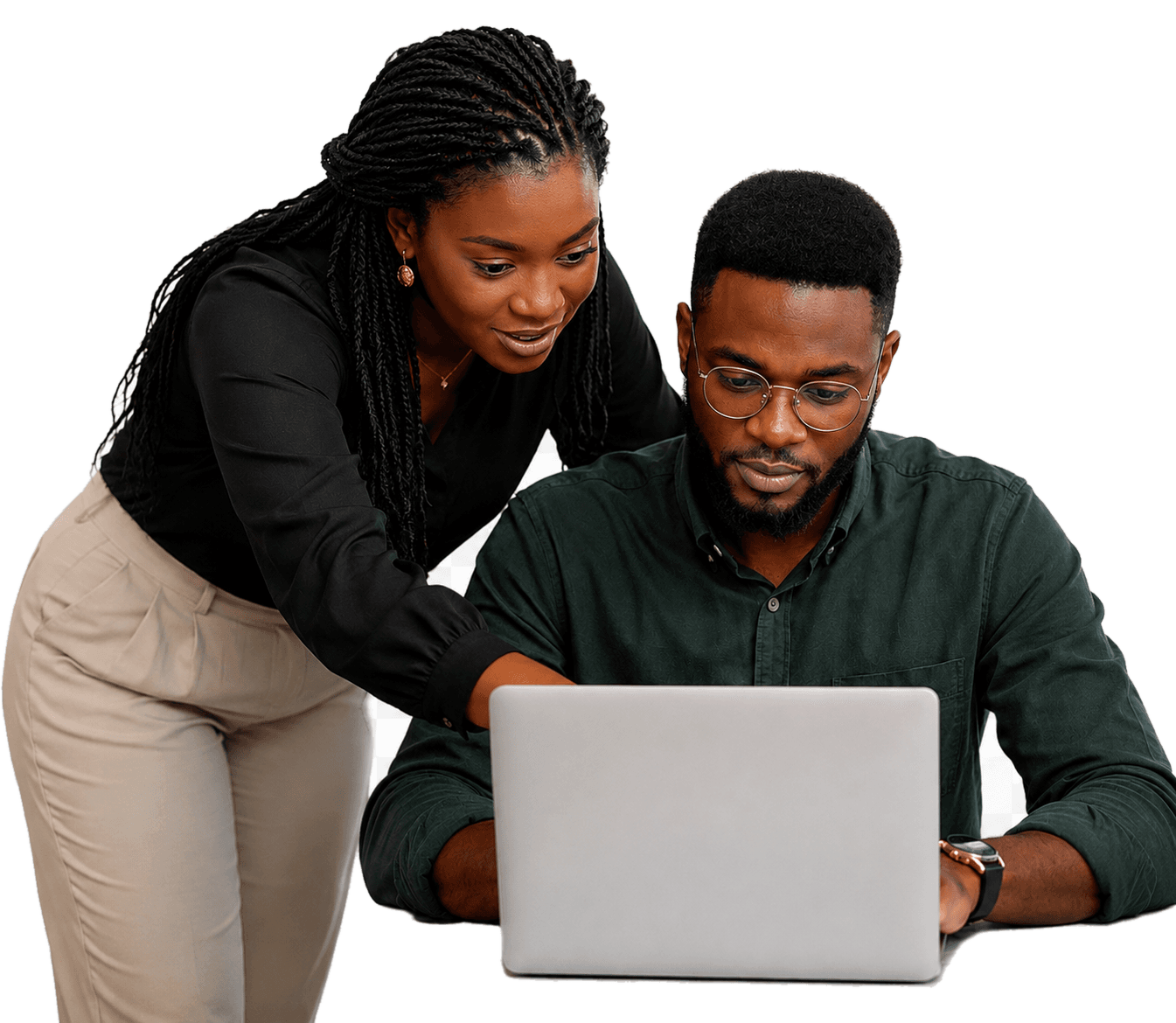Mentor guiding a learner at a laptop
